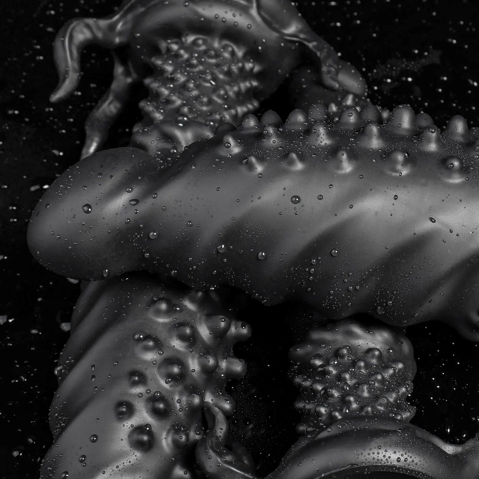 Black "Abyss" Spiked Fantasy Dildo by Oieffur, made of platinum silicone, featuring a textured, monster-style design for intimate use.